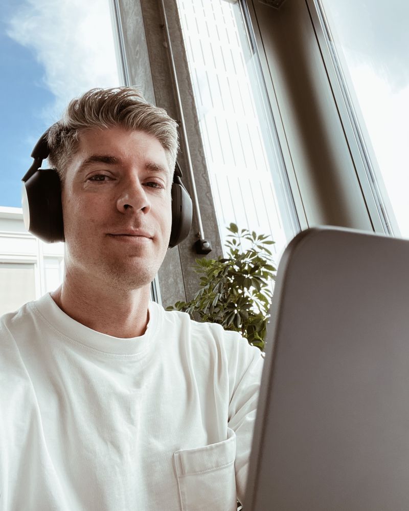 Nick working at a laptop with headphones at JobCloud